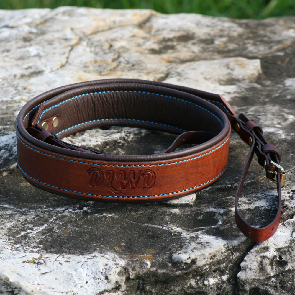 Medium brown with brown padding, turquoise thread and polished brass hardware